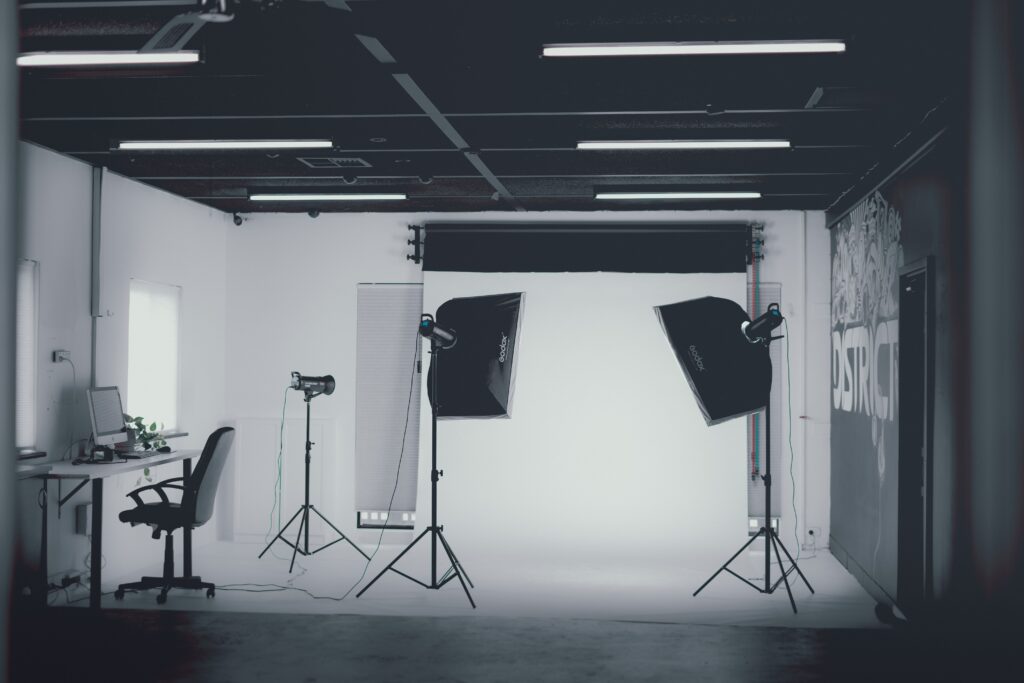 Modern photo studio in grayscale with softbox lighting. Ideal for portrait and product photography.